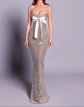Elegant evening gown with a white bow on a gray background