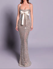 Elegant evening gown with a white bow on a gray background