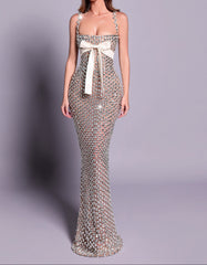 Elegant evening gown with a white bow on a gray background