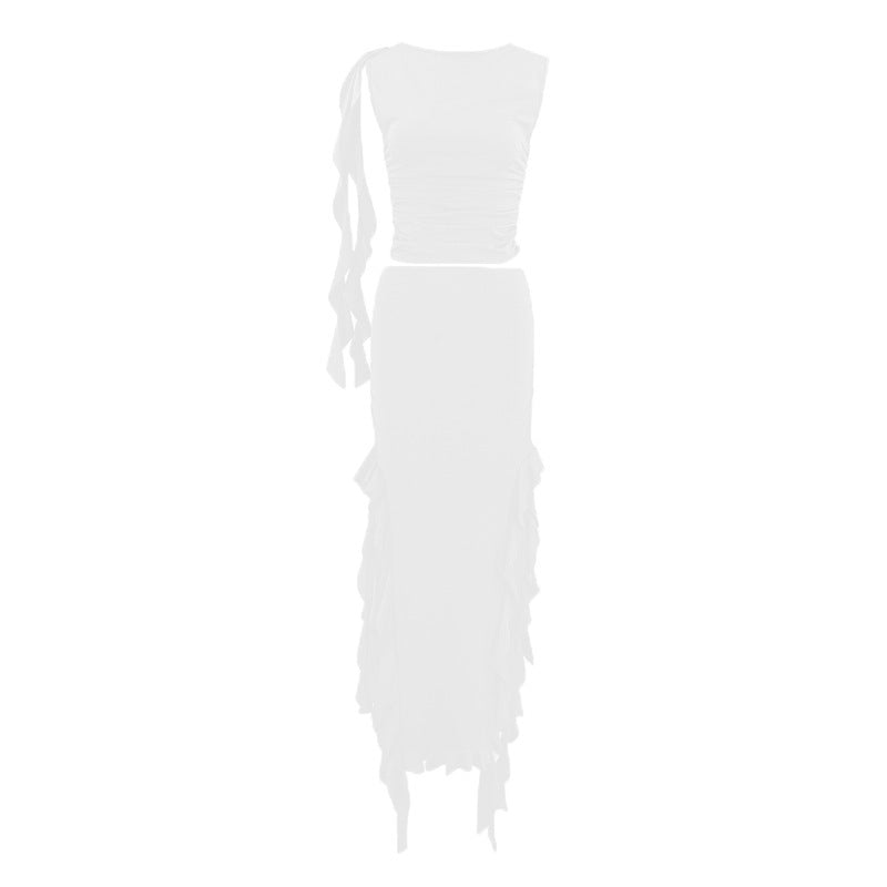White one-shoulder dress with ruffled details on a white background