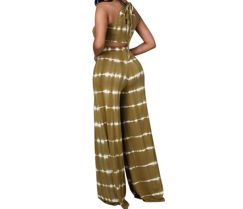 Woman wearing a tie-dye outfit with a white background