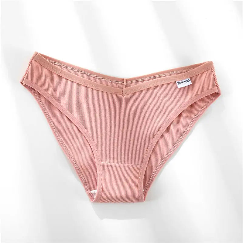 Pink ribbed underwear on a white background
