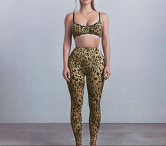 Person wearing a leopard print sports bra and leggings set against a plain background