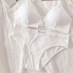White ribbed underwear set on a textured white surface with 'Fashion' labels.