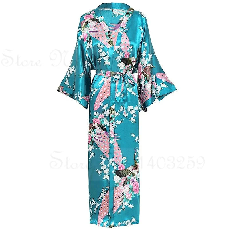 Teal satin robe with floral and bird pattern on a white background