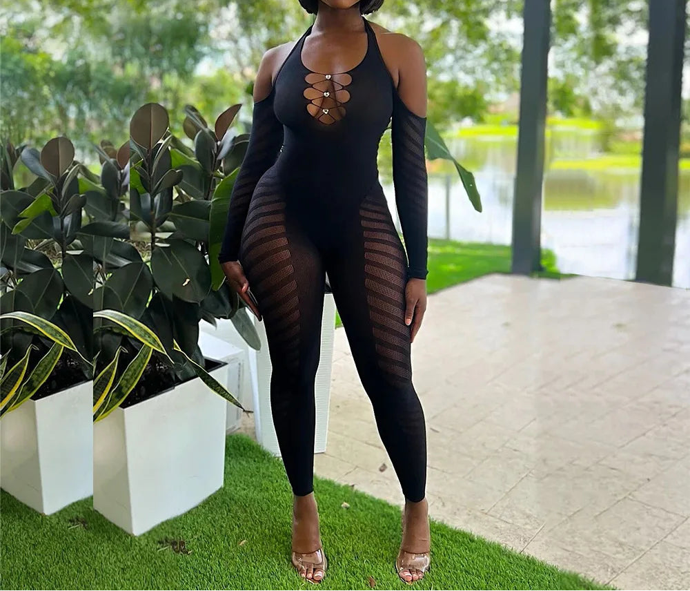 Woman wearing a black outfit with sheer panels in an outdoor setting