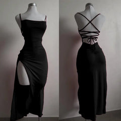 Black dress with a front slit and criss-cross back on a mannequin against a neutral background