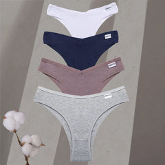 Four pairs of underwear in white, blue, pink, and gray on a neutral background with cotton branches.