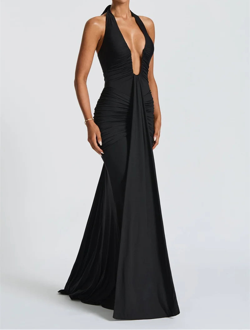 Black evening gown with a plunging neckline on a white background