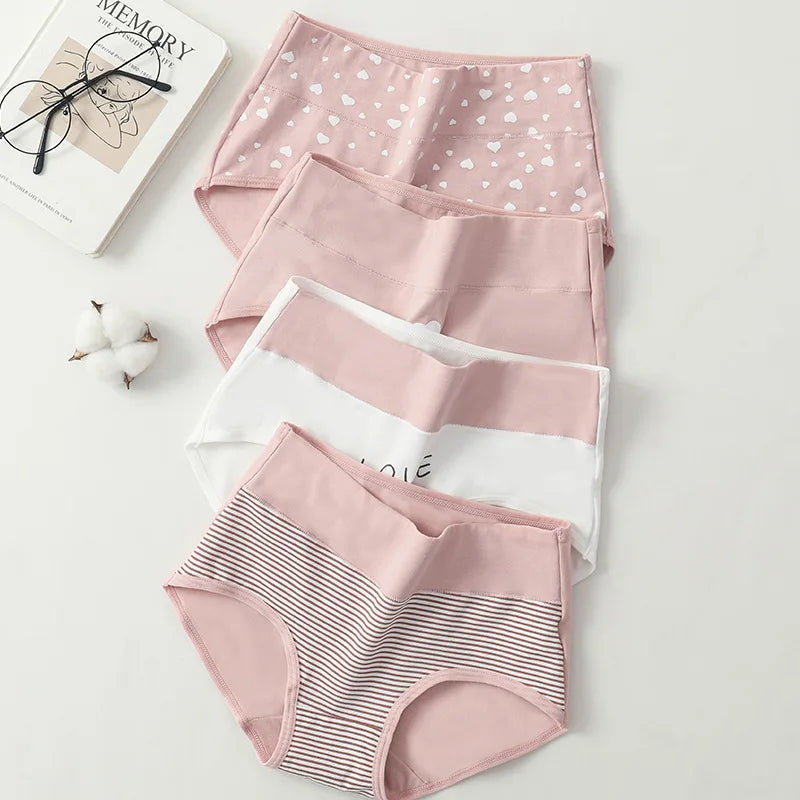 4 Set of pink women's underwear with different patterns on a light gray background