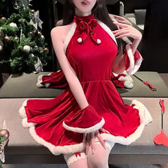 Person wearing a red dress with white trim in a festive setting