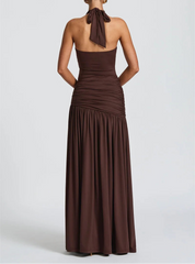 Brown halter neck gown on a white background