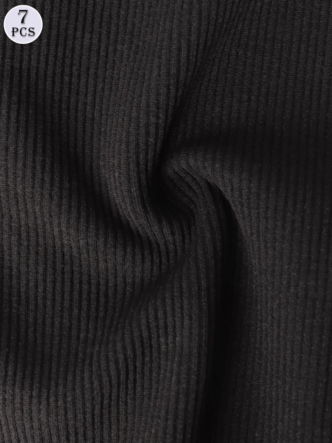 Close-up of black ribbed fabric with a label indicating 7 pieces.