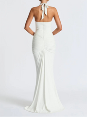 White evening gown with a halter neck design on a white background