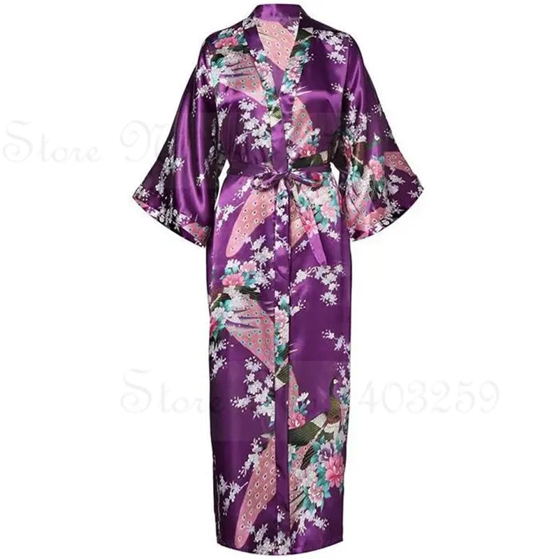 Purple satin robe with floral patterns and a pocket on a white background