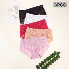 Five pairs of women's lace panties in black, white, red, peach, and light pink are arranged in a vertical stack on a light beige background. A gray '3PCS' label is in the top right corner, and a small decorative leaf sprig and cup-and saucer are used as flat-lay props.