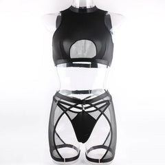 Black mesh top and shorts set on a mannequin against a white background