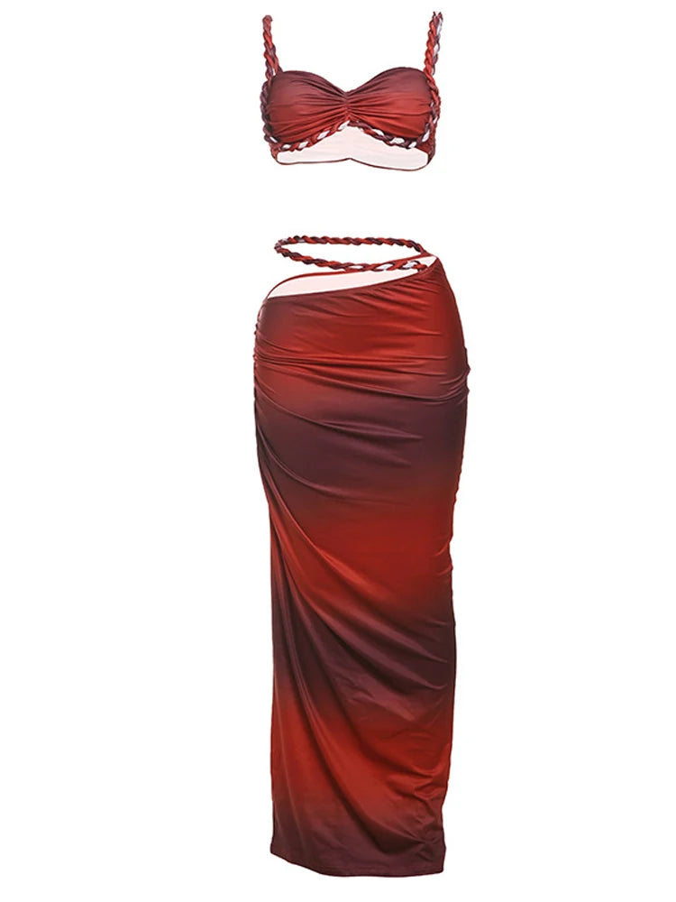 Red two-piece dress with a strapless top and draped skirt on a white background