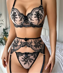 Black lace lingerie set with 'TOUCHEART' branding on a neutral background