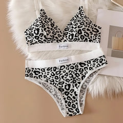 Leopard print bra and panties set on a beige background