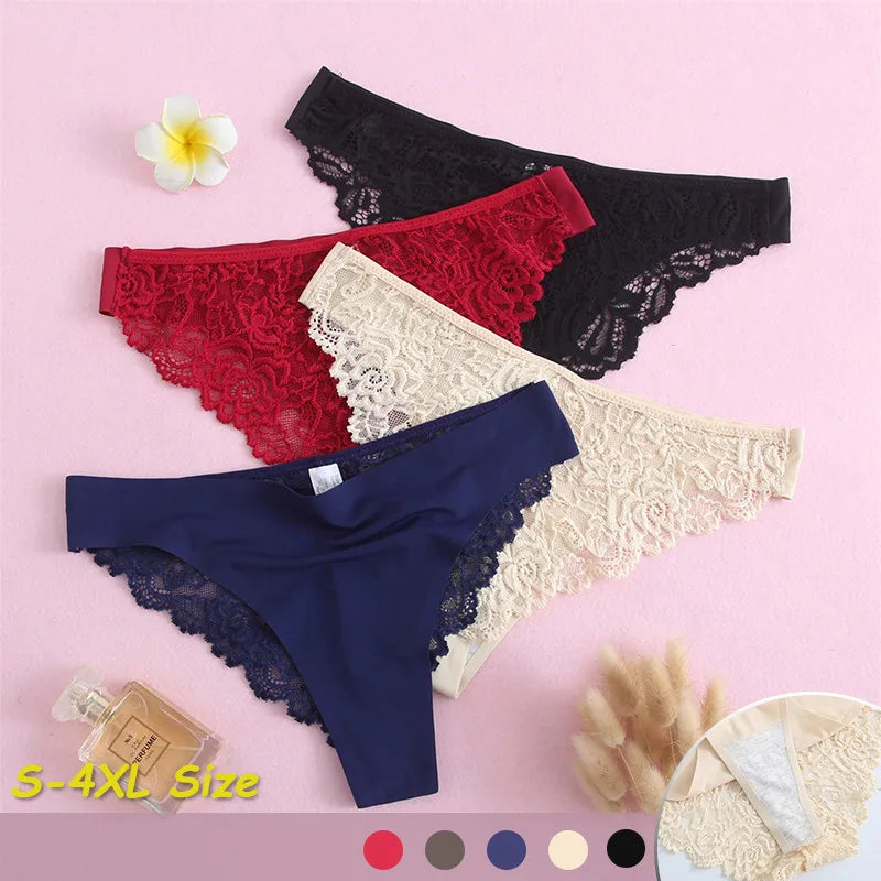 Four pairs of lace-trimmed panties in different colors on a pink background.