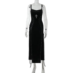 Black dress with a cross detail on a mannequin against a white background