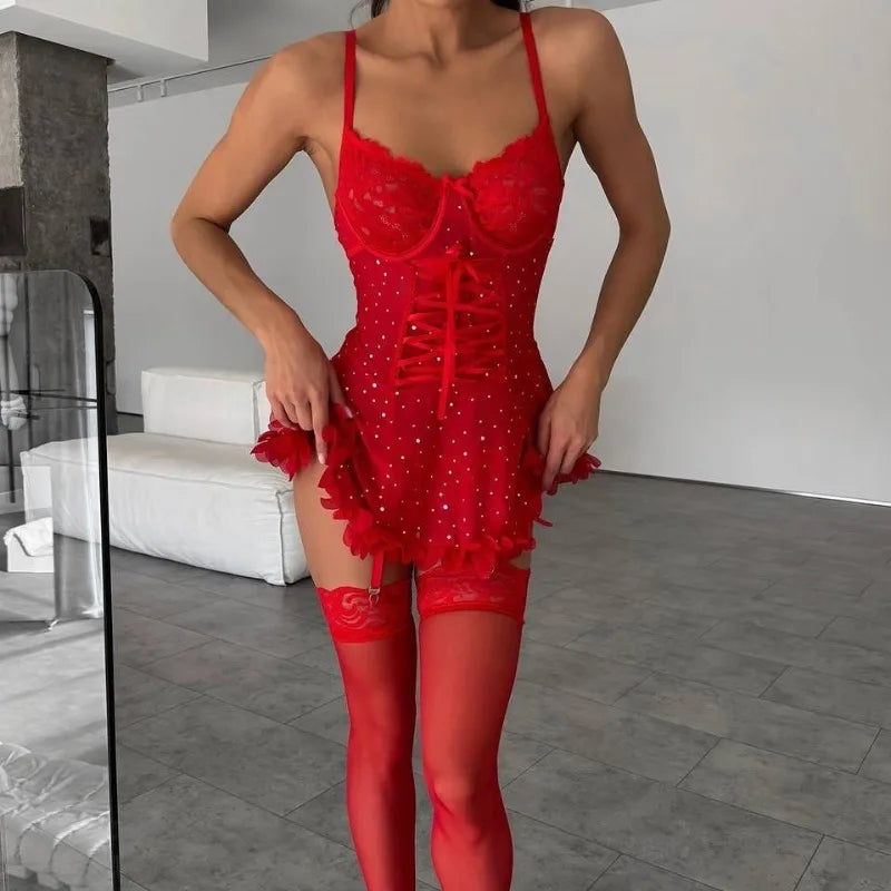 Person wearing a red lace lingerie set in a modern room.