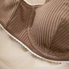 Close-up of a ribbed brown fabric with a beige background