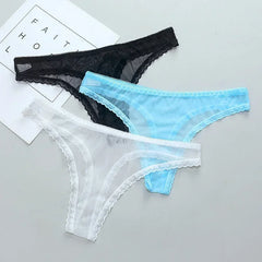 Three pairs of lace-trimmed panties in black, blue, and white on a light gray background.