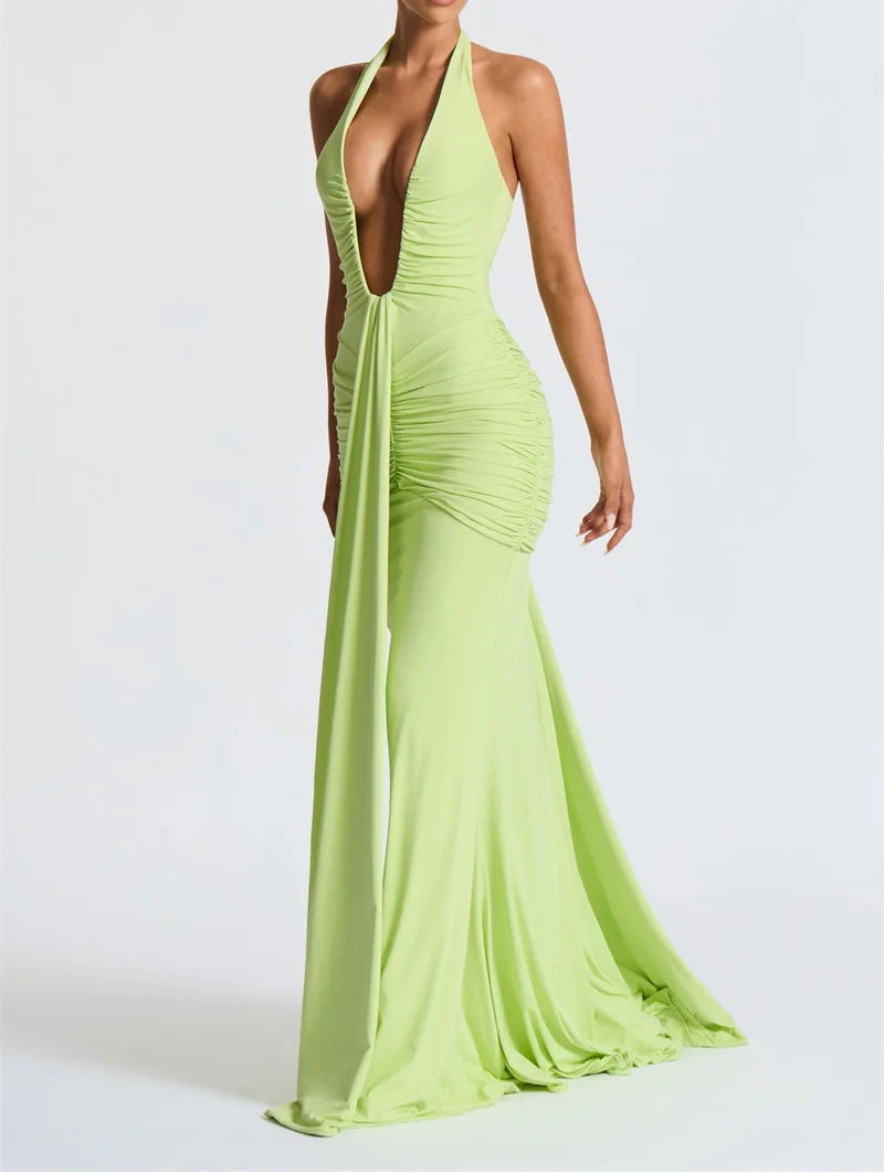 Woman wearing a bright green evening gown on a white background