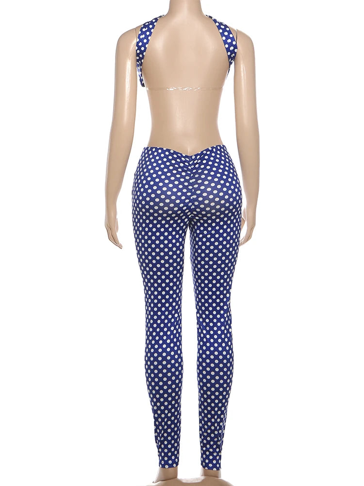 Mannequin wearing a blue and white polka dot swimsuit on a white background