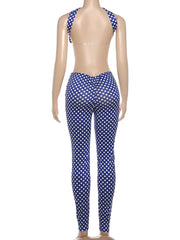 Mannequin wearing a blue and white polka dot swimsuit on a white background