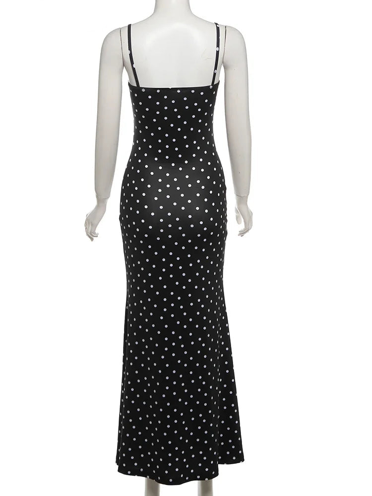 Black polka dot dress on a mannequin with 'WeirdPuss' branding.