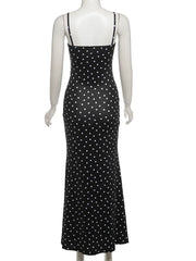 Black polka dot dress on a mannequin with 'WeirdPuss' branding.