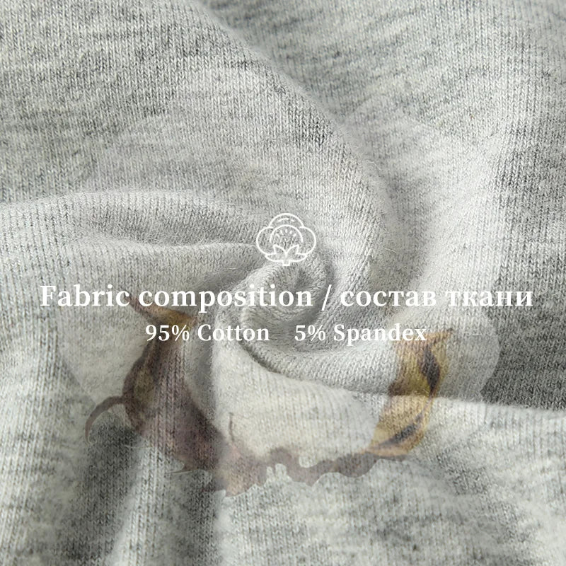 Close-up of gray fabric with a floral pattern, featuring fabric composition text overlay.