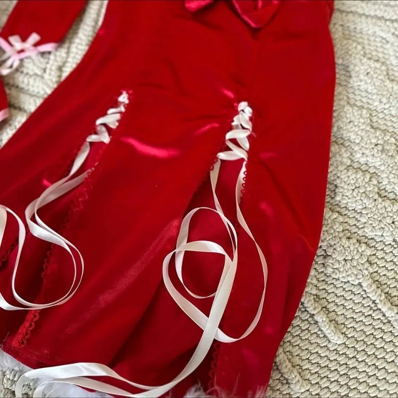 Red fabric with white ribbons on a textured beige surface