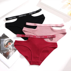 Three pairs of underwear in black, pink, and red with 'FINE TOO' branding on the waistbands.