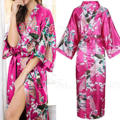 Pink floral satin robe with a model wearing it, displayed against a neutral background.