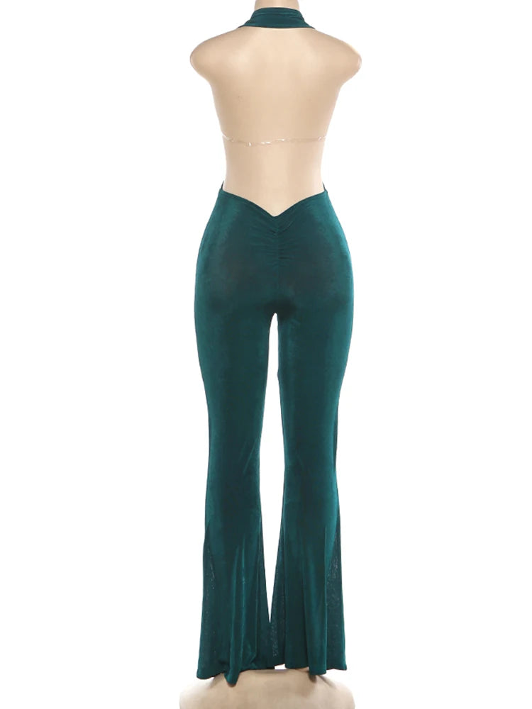 Green dress pants on a mannequin against a white background