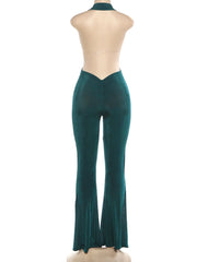 Green dress pants on a mannequin against a white background