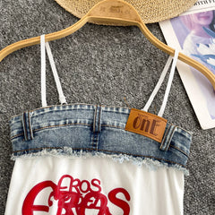 Denim top with 'oneF' label on a hanger against a gray background