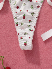 White underwear with fruit pattern on a pink background
