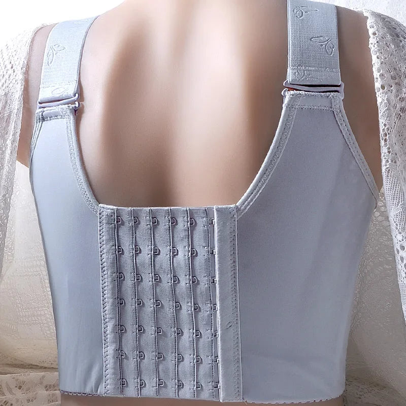 Light gray corset with adjustable straps on a neutral background