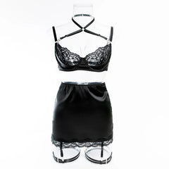 Black lace lingerie set on a mannequin against a white background