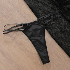 Black lace lingerie set on a wooden surface