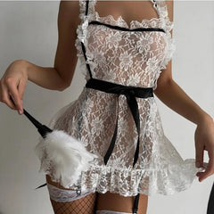White lace apron with black trim worn by a person, holding a white feather duster.