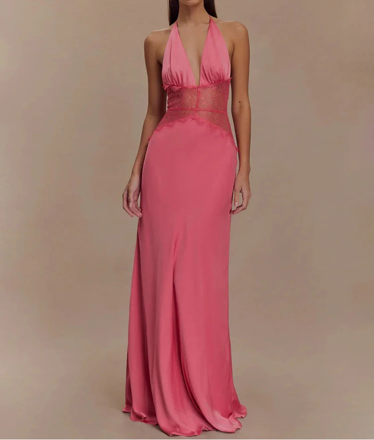 Woman wearing a pink evening gown against a beige background