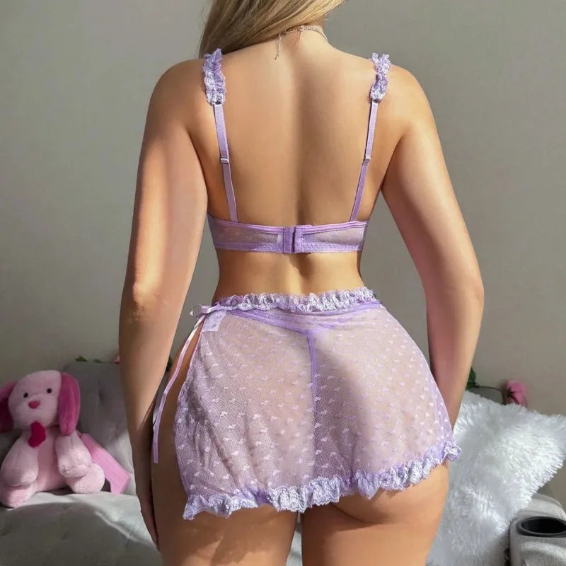 Person wearing a lavender lingerie set with a neutral background