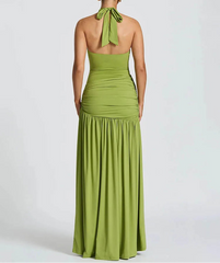Green halter neck gown on a white background