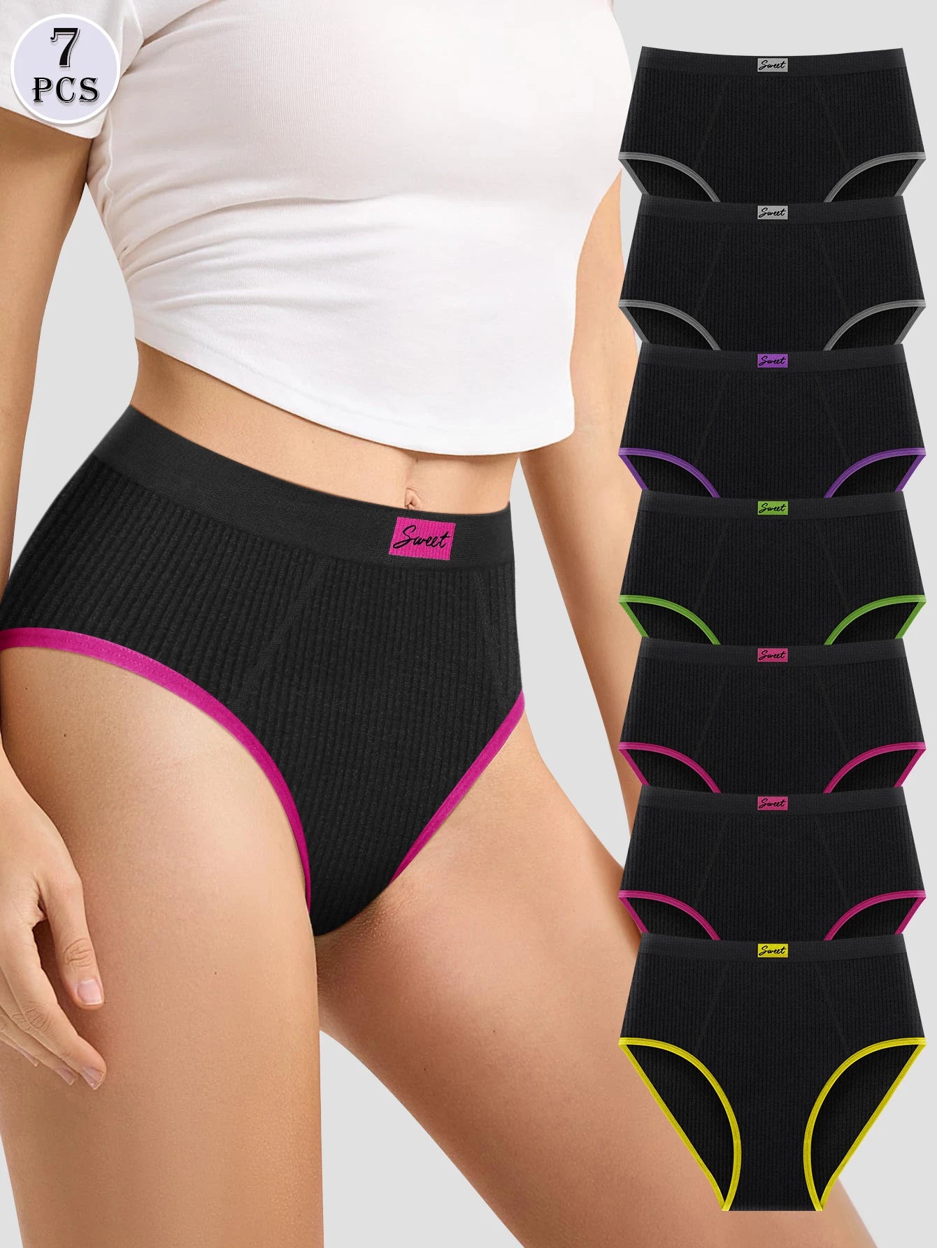 Woman wearing black underwear with colorful trim, surrounded by additional black underwear pieces on a white background.